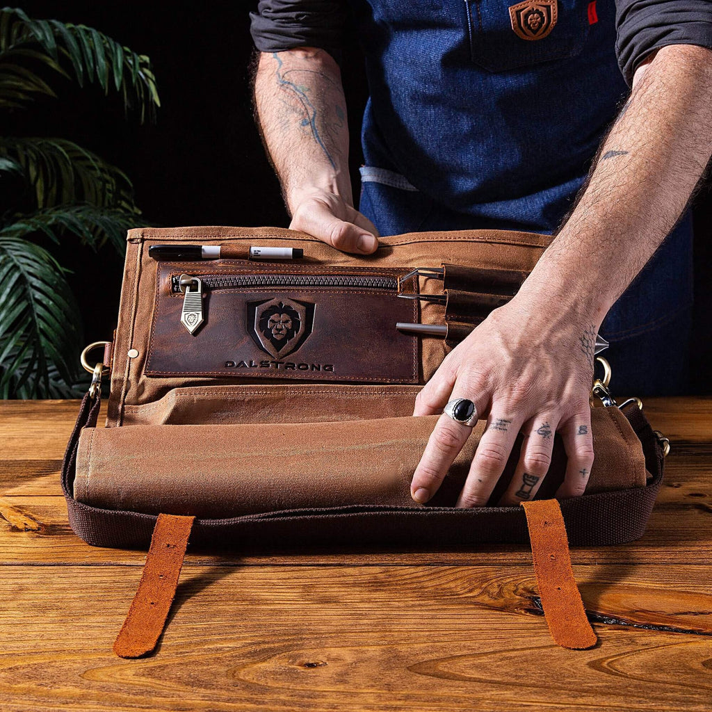 A photo of a man opening the 12oz Heavy Duty Canvas & Leather Desert Drifter Brown | Nomad Knife Roll | Dalstrong