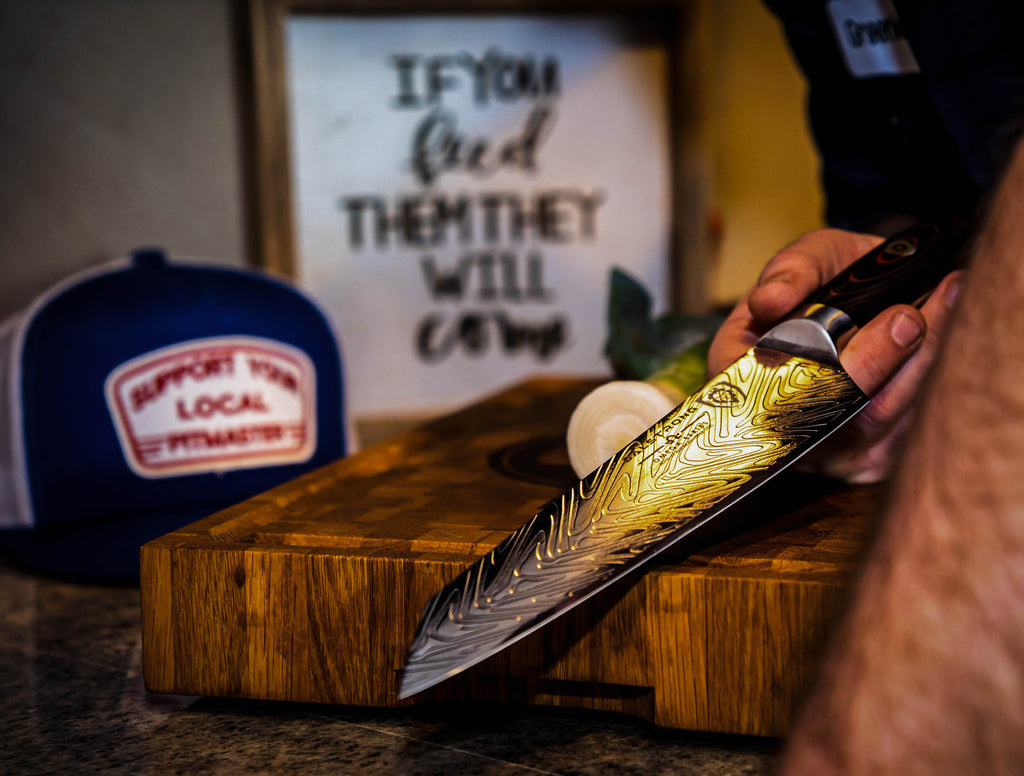 James Greenleaf (@greenleaf.bbq) holding Dalstrong's Omega Series Chef Knife