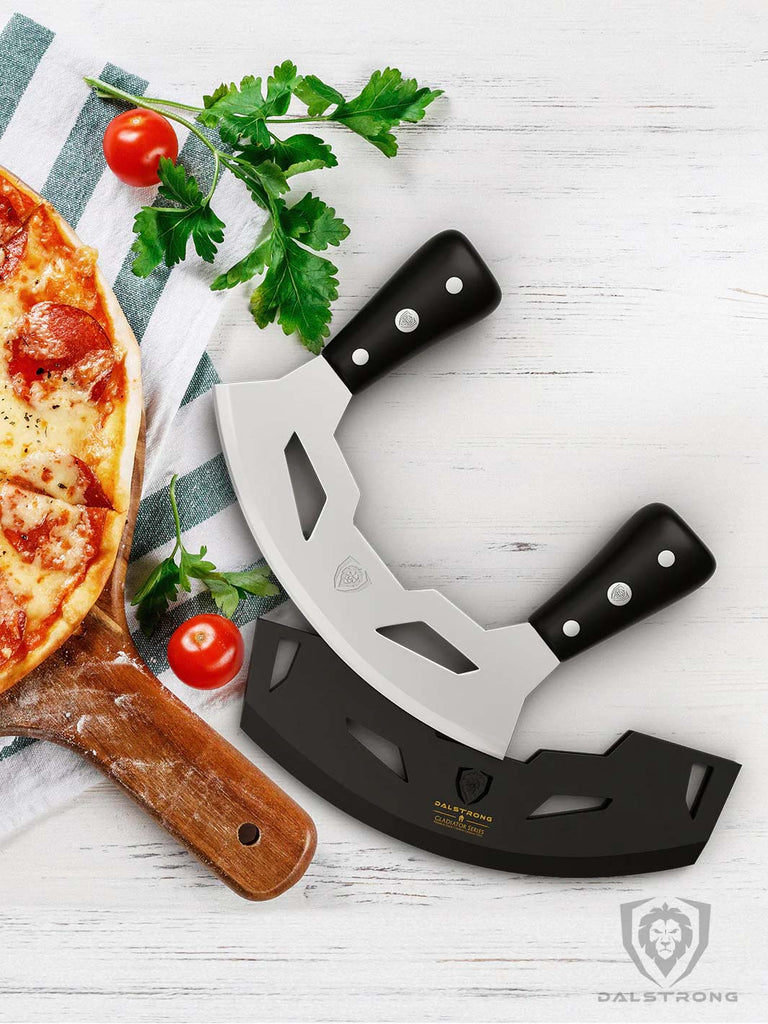 Mezzaluna Knife 8.5" ABS Handles Gladiator Series Dalstrong beside a pizza.