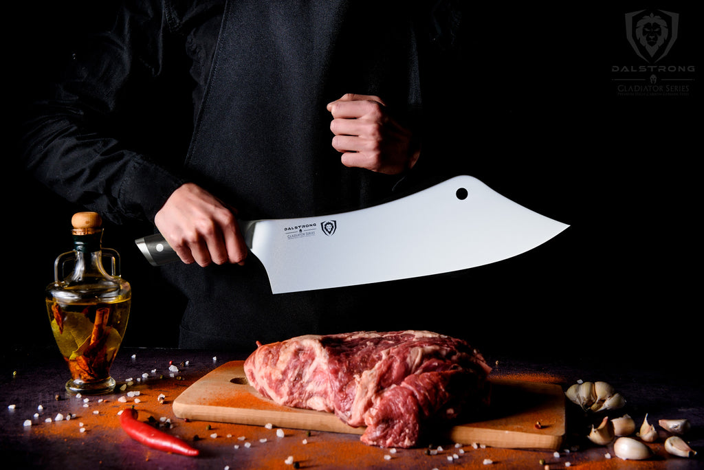 chef and cleaver hybrid about to slice into raw meat