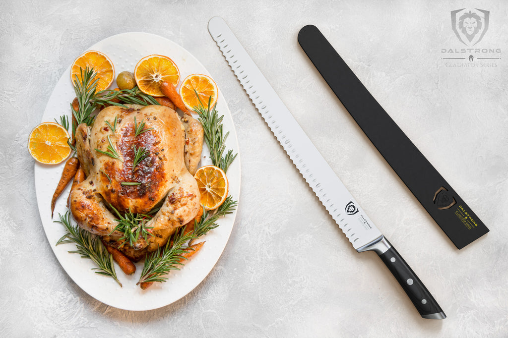 A long serrated slicing knife next to a whole cooked chicken on a white plate 