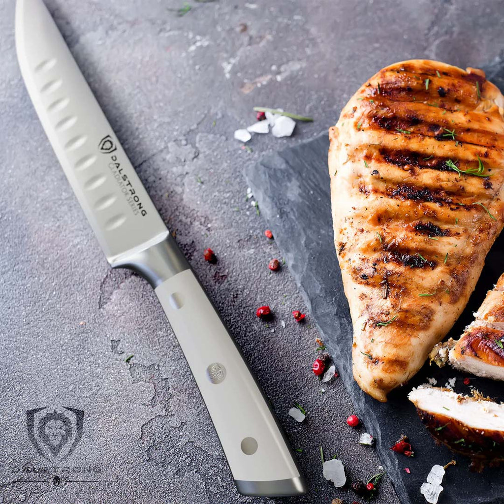 A photo of the 4-Piece Straight-Edge Steak Knife Set | Glacial White ABS Handles | Gladiator Series | NSF Certified | Dalstrong with a grilled steak in the side