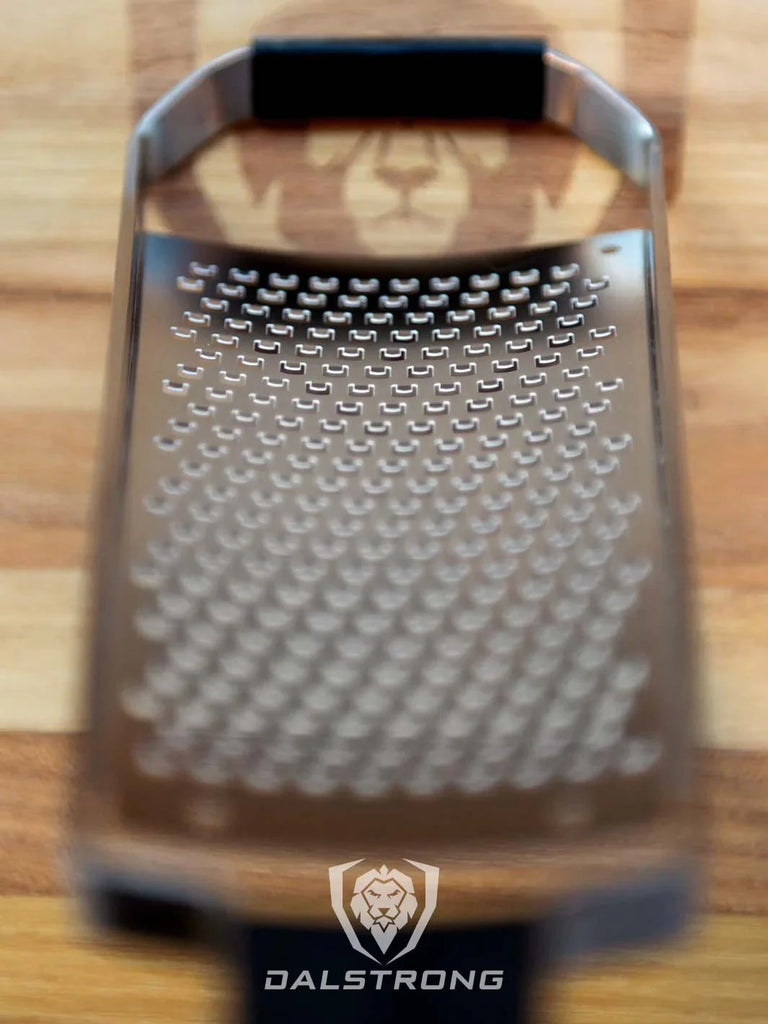 A close-up photo of the Professional Coarse Wide Cheese Grater | Dalstrong