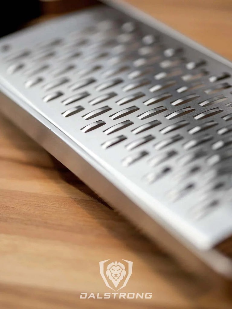 A close-up photo of the Professional Ribbon Wide Cheese Grater | Dalstrong