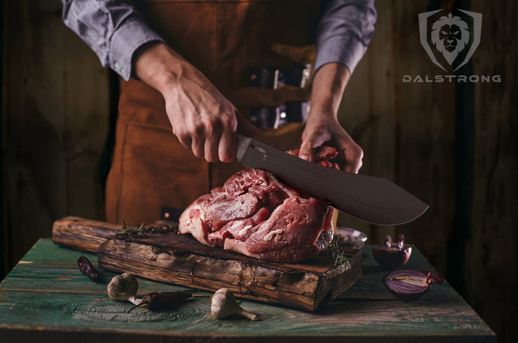 Man uses black bull nose butcher knife to slice raw meat on a wooden cutting board