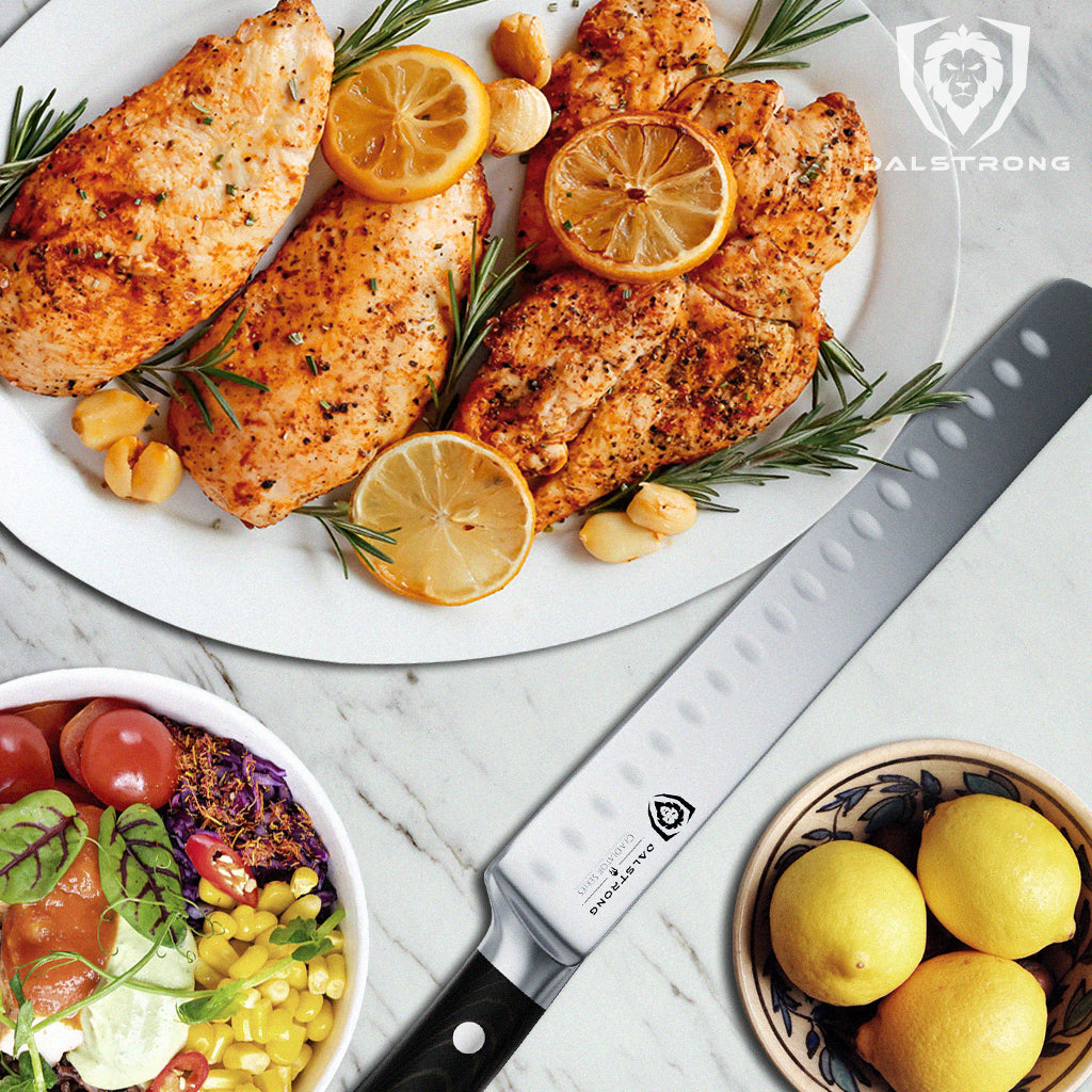 A plate of lemon peppered chicken next to garnish and a kitchen knife