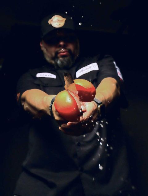 Chef Steve Hernandez chopping an apple in mid air
