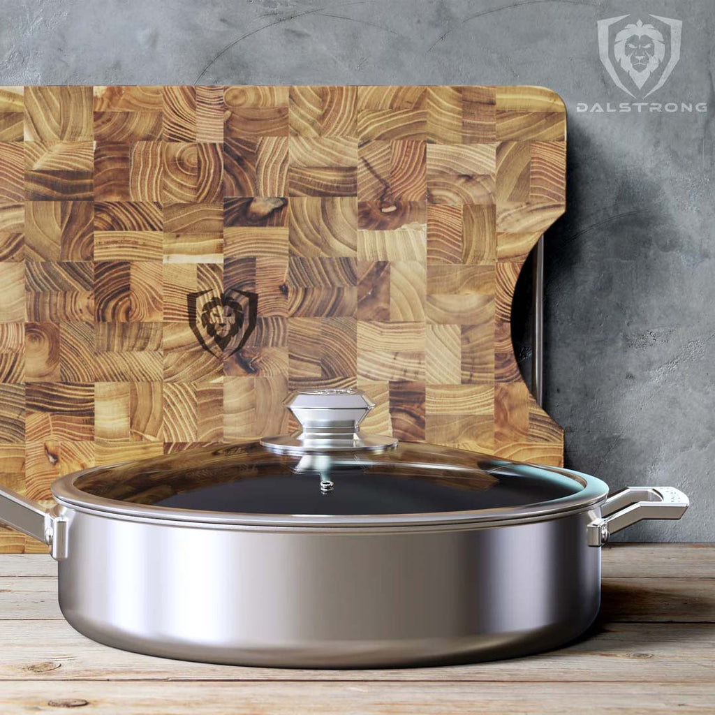 12" Sauté Frying Pan | ETERNA Non-stick | Oberon Series | Dalstrong in front of a dalstrong cutting board.