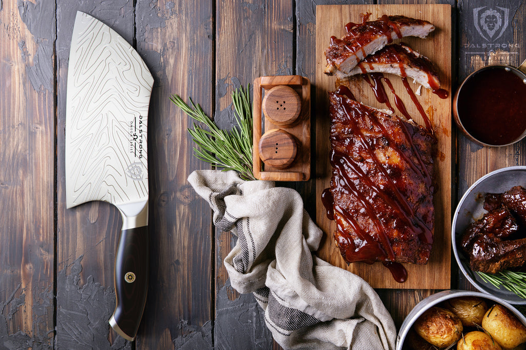 cleaver knife beside bbq ribs