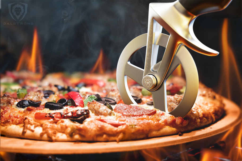 Dalstrong PIzza Pizza Wheel Cutter Slicing Through A Cooked Pizza With Flames In The Background
