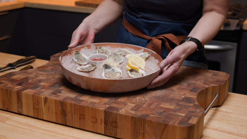 Shucked oyster on a plate full of ice.