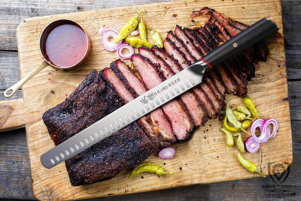 Long carving knife on top of sliced bbq brisket on a wooden cutting board