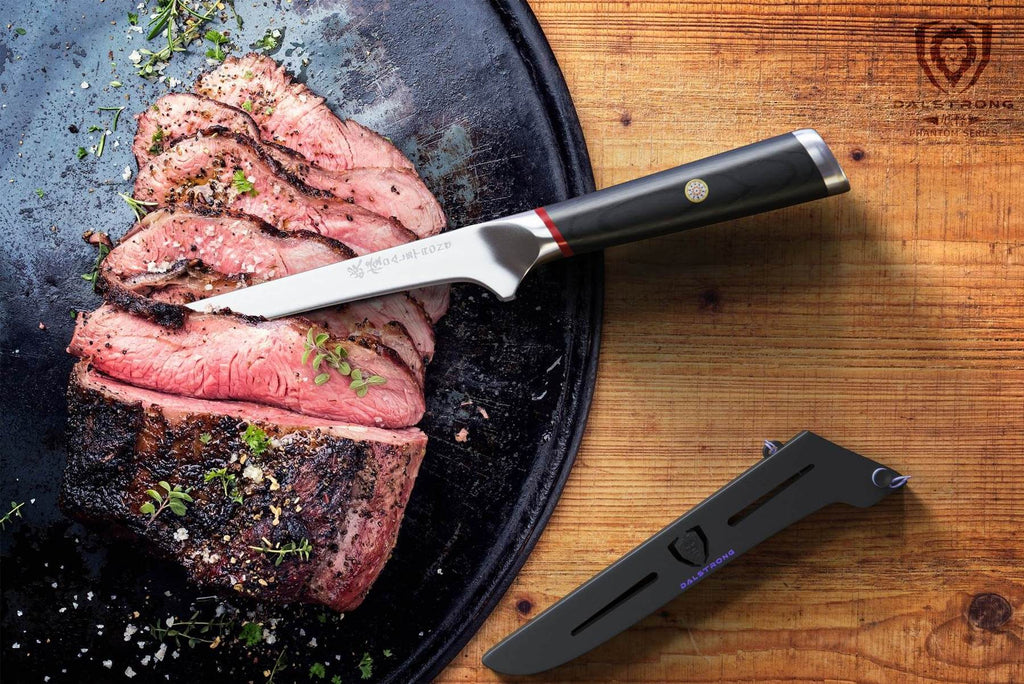 boning knife laying on counter after cutting a steak