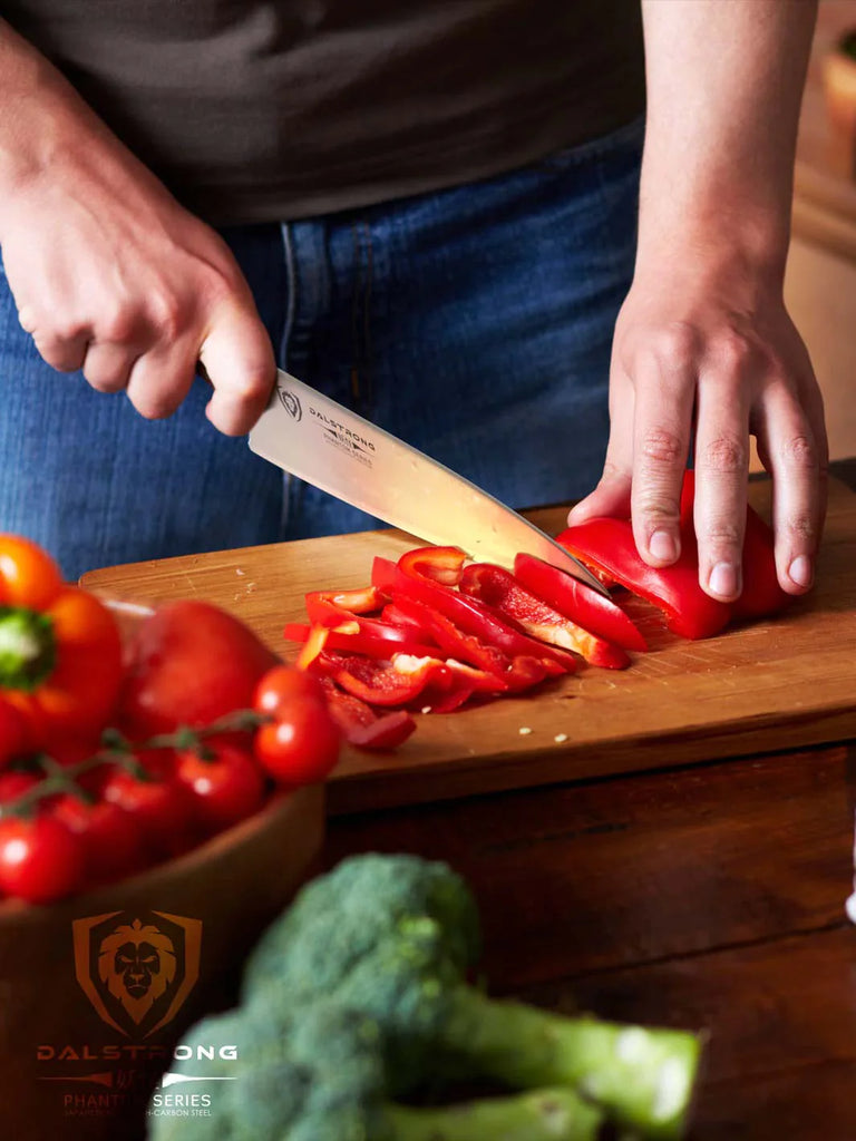 A photo of a man slicing a bell pepper with the Chef's Knife 8" | Phantom Series | Dalstrong