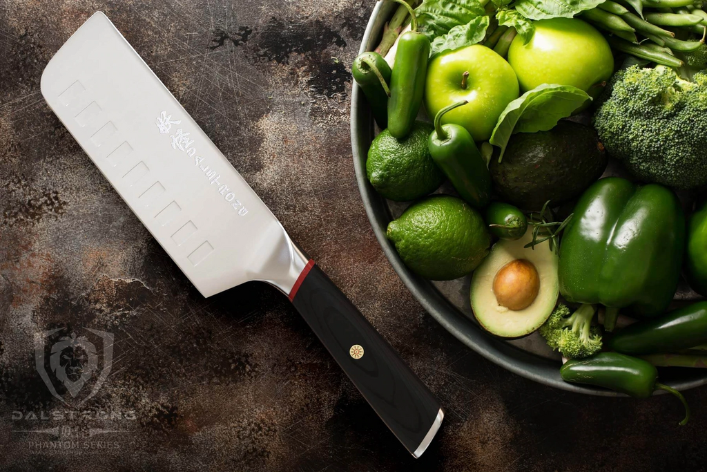 Nakiri knife laying beside green veggies