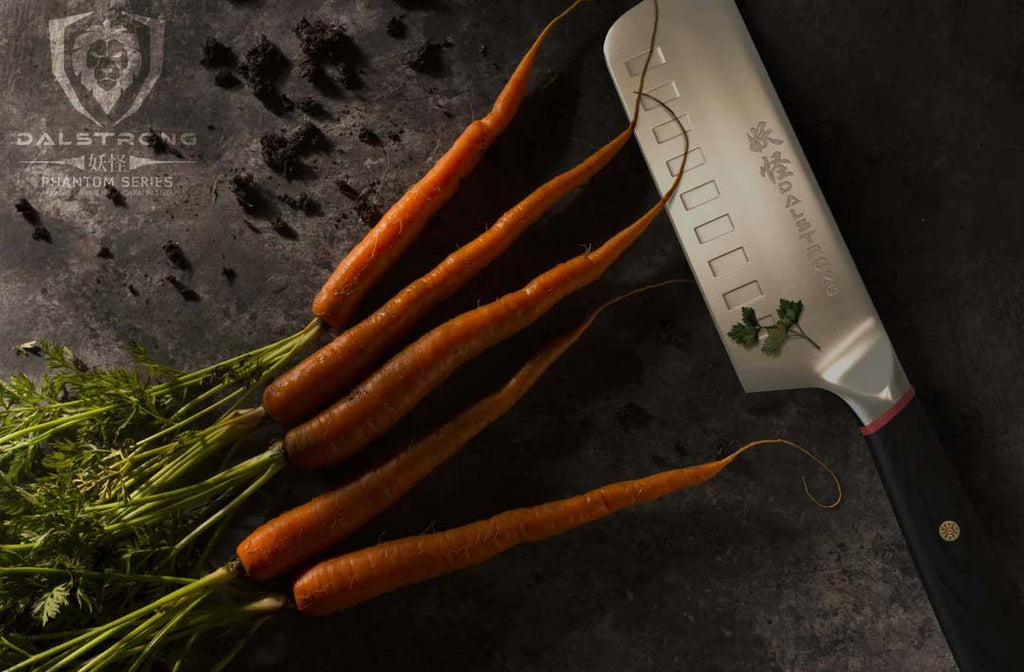 Nakiri Vegetable Knife 6" | Phantom Series | Dalstrong with carrots beside.