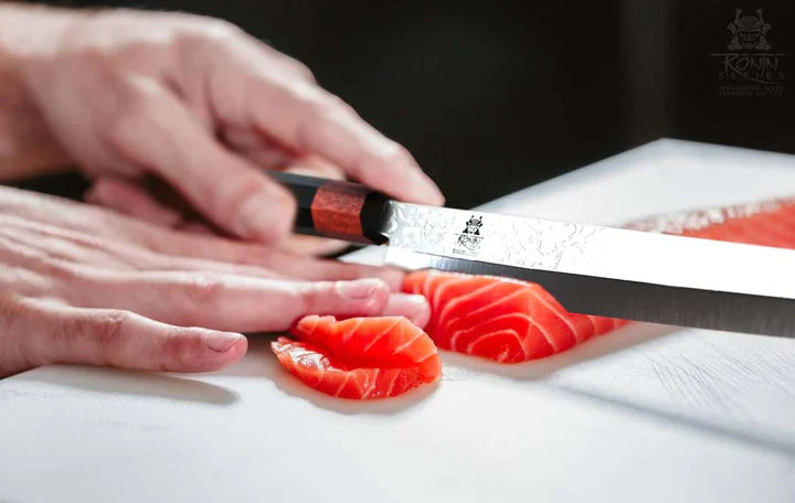 Slicing fish meat using the Ronin Series Yanagiba & Sushi Knife 10.5"