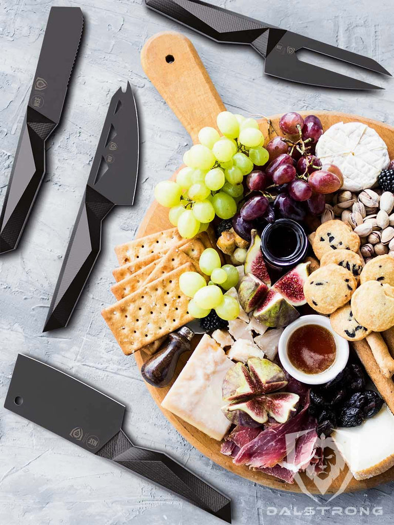 A beautiful charcuterie board beside the Dalstrong Shadow Black Series Cheese Knife Set