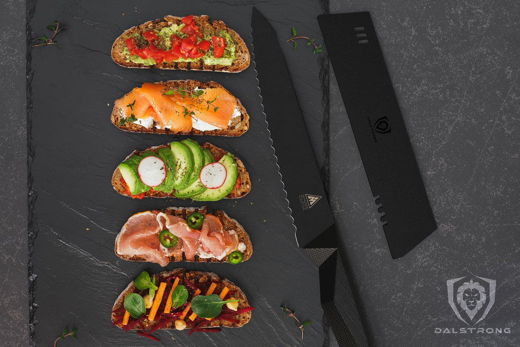 Five slices of bread with various toppings on a black cutting board next to a black utility knife