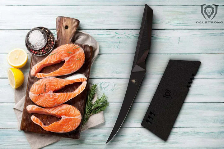 Shadow Black Series Curved Boning Knife 6" beside three cuts of salmon.