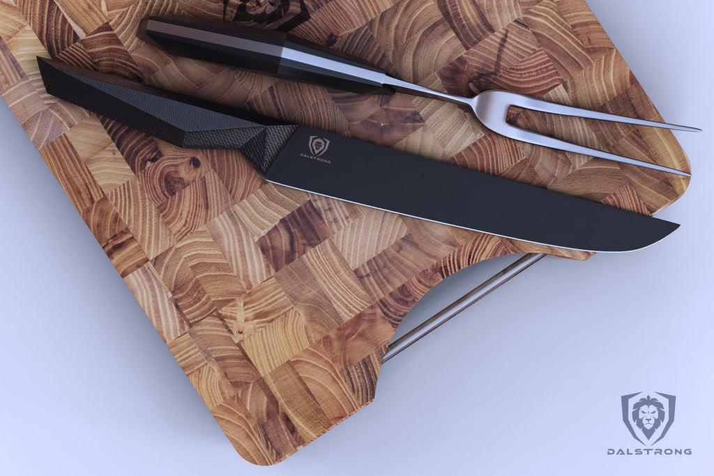 Black carving knife and steel fork on a wooden cutting board with a white background