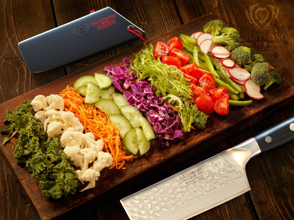 nakiri knife laying beside assorted chopped veggies