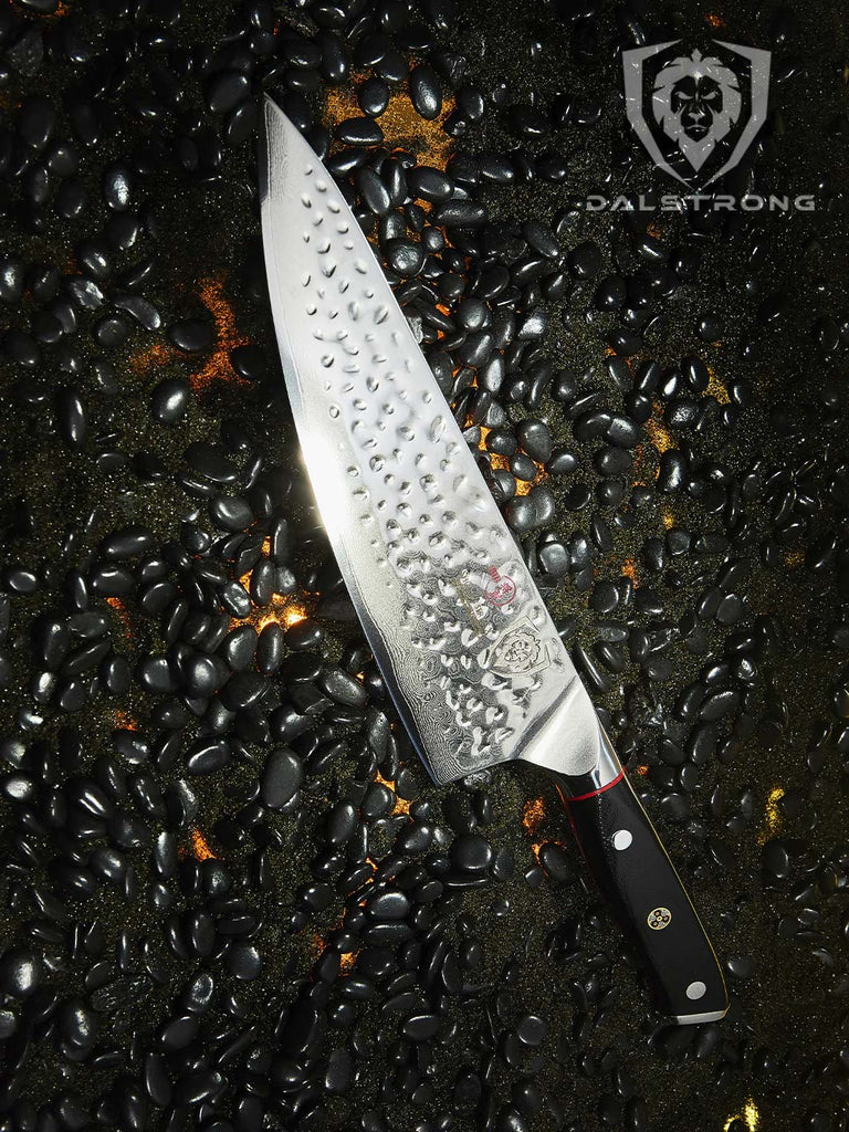 A photo of the Chef's Knife 8" | Shogun Series ELITE with black pebbles.