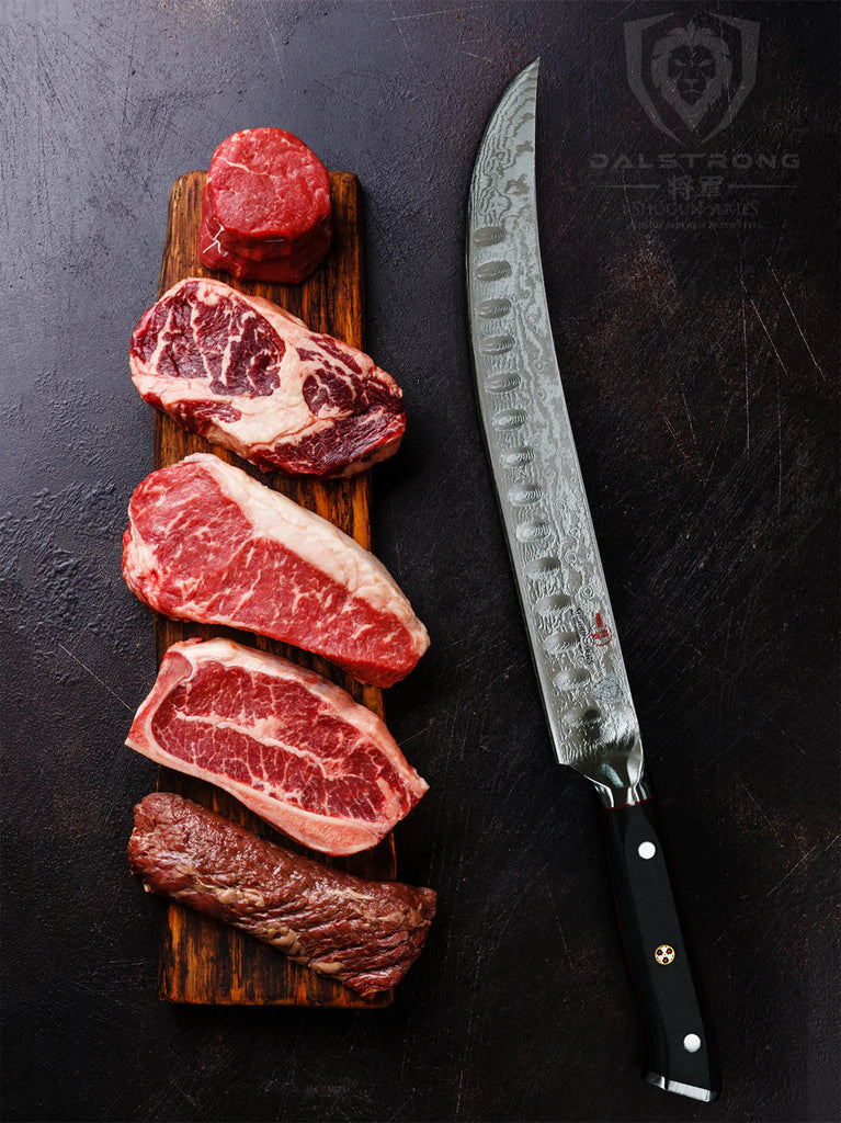 Butcher's Breaking Cimitar Knife 10" | Shogun Series ELITE | Dalstrong with five different cuts of steaks on top of a wood.