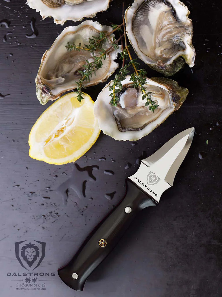 Professional Oyster & Clam Shucking Knife 3.5" | Shogun Series ELITE | Dalstrong beside shucked oysters.