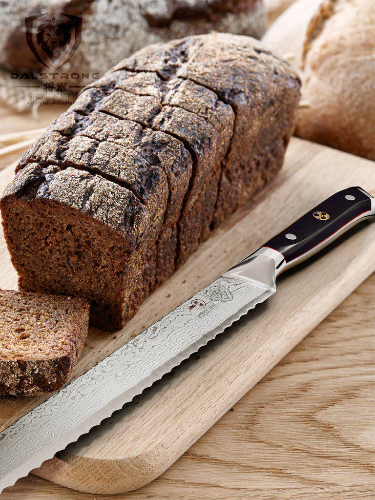 Bread Knife 10.25" | Shogun Series ELITE | Dalstrong with slices of bread on a wooden board.