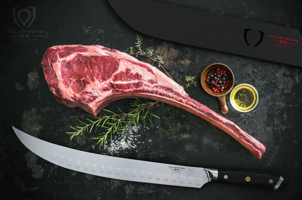 A sharp butcher knife on a black surface beneath a large steak on the bone