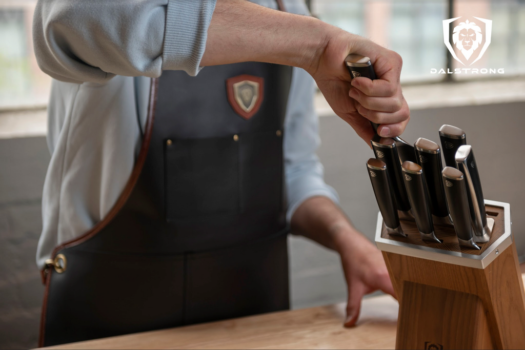 Man lifting kitchen knife from a wooden block set