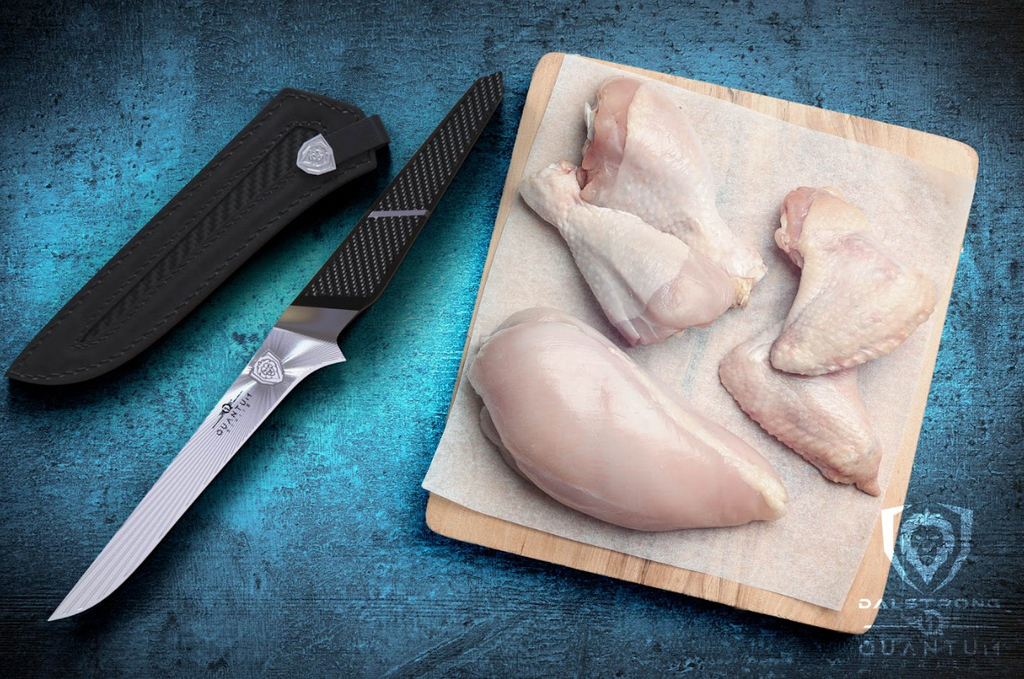 A photo of the Boning Knife 6" Quantum 1 Series Dalstrong with five different cuts of chicken meat on top of a wooden board