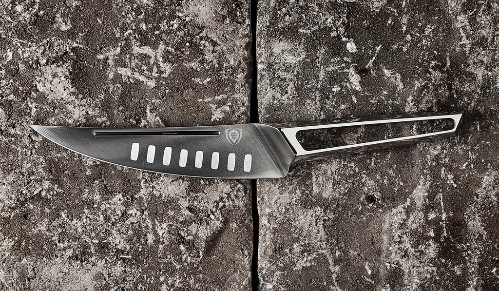 A close-up photo of the Fillet Knife 6.5" Crusader Series NSF Certified Dalstrong on a rough surface