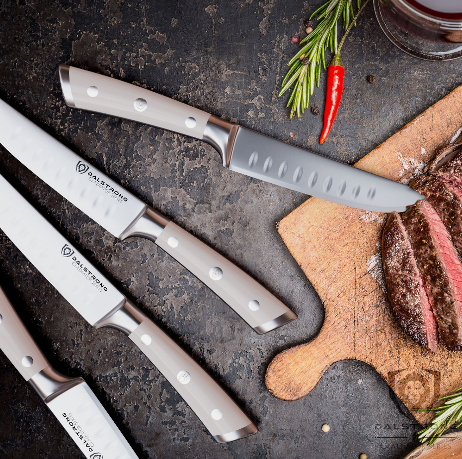 Dalstrong Gladiator 4-Piece Straight-Edge Steak Knife Set with a freshly cooked steak on a wooden cutting board on the side