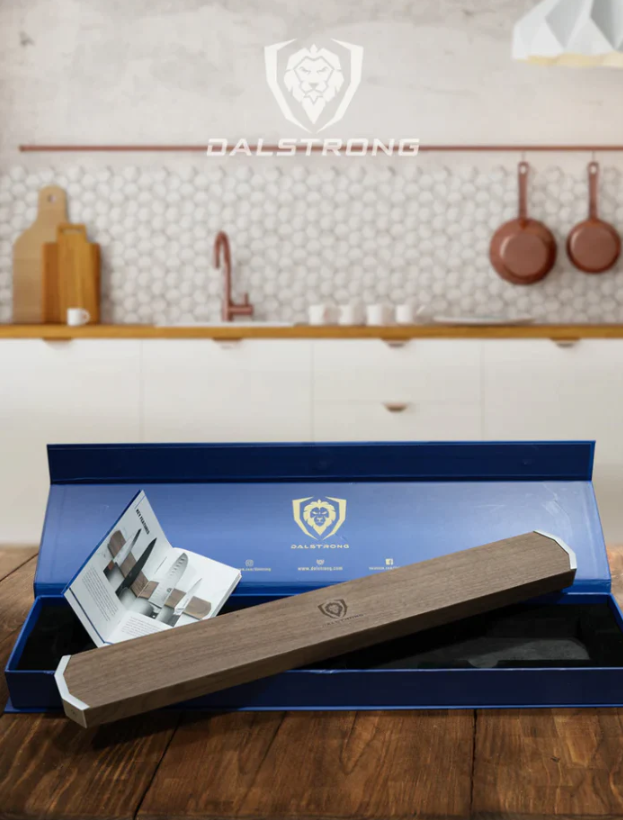 A photo of the Magnetic Bar Walnut Wall Knife Holder Dalstrong with its box on top of a wooden table