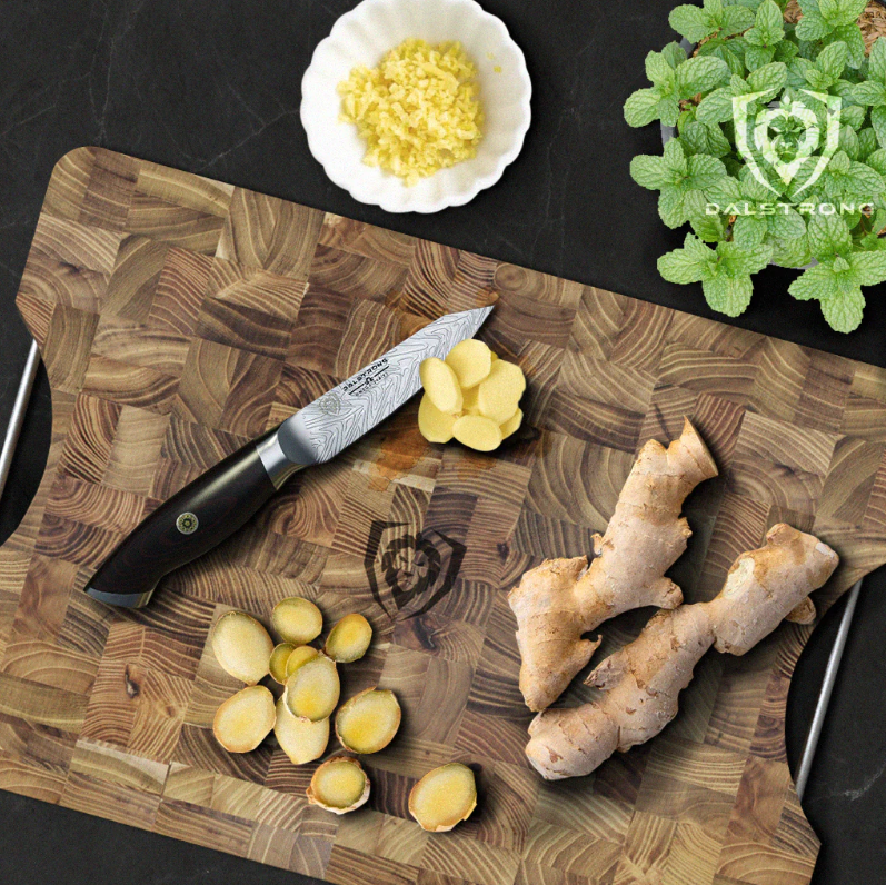 A photo of ginger root on cutting board with Dalstrong paring knife