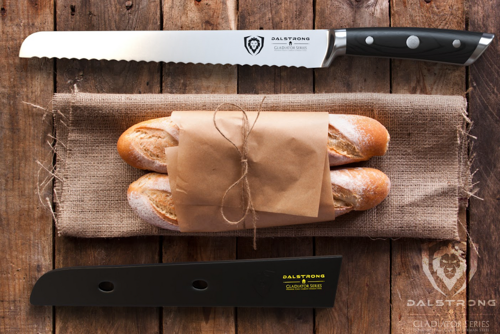 A photo of the Serrated Bread Knife 10" Gladiator Series | NSF Certified | Dalstrong with two bread beside it in top of a wooden table