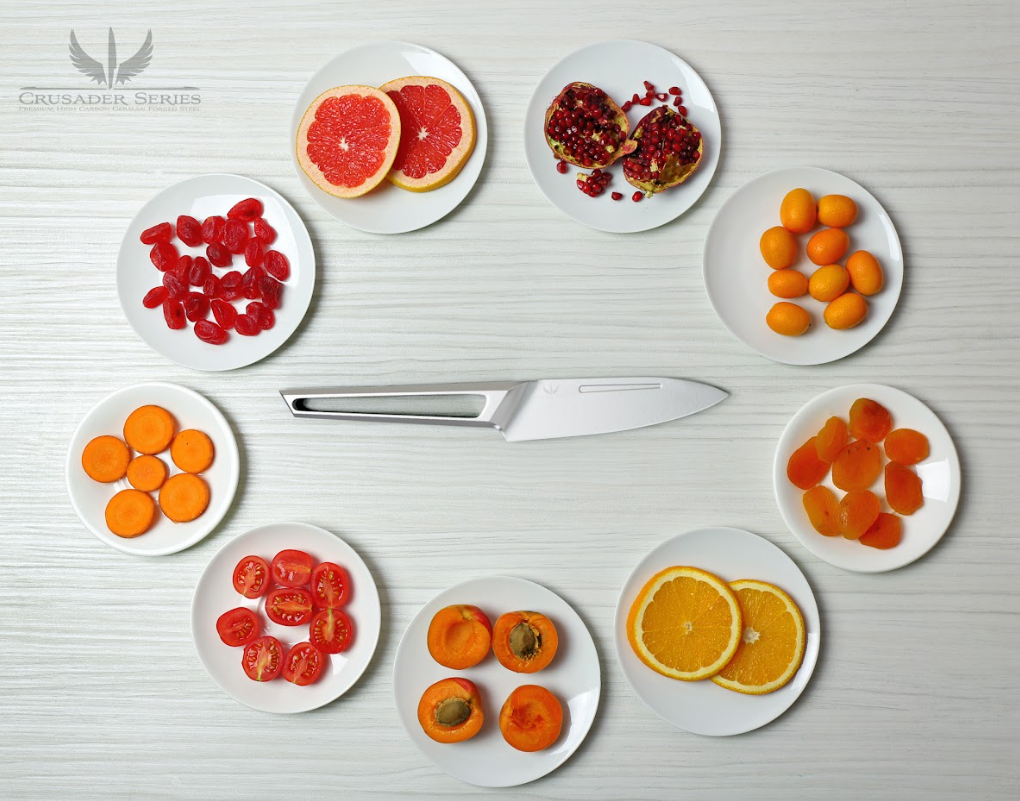 A photo of the Paring Knife 3.5" Crusader Series | NSF Certified | Dalstrong with different kinds of slices of fruits in a plate.