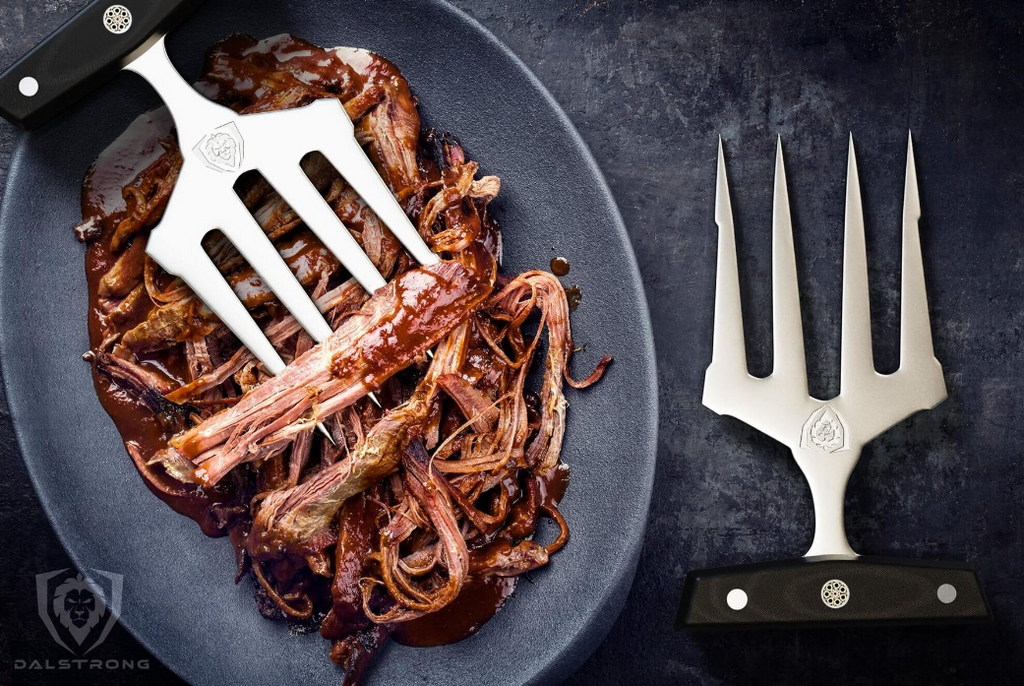 A photo of the Dalstrong Meat Shredding Claws with perfectly shredded meat in a ceramic plate