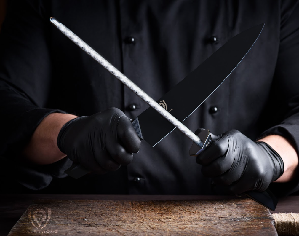A photo of a chef honing a Shadow Black Series Knife with the Honing Steel 9" Shadow Black Series | NSF Certified | Dalstrong