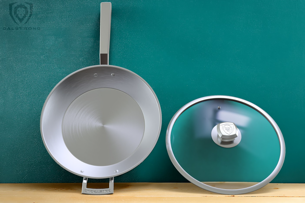 A photo of the 12" Frying Pan & Skillet Silver Oberon Series Dalstrong on top of a wooden table