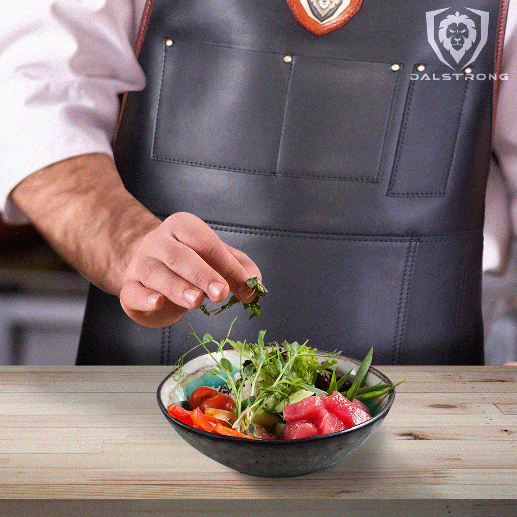 tuna poke bowl in front of chef with apron on