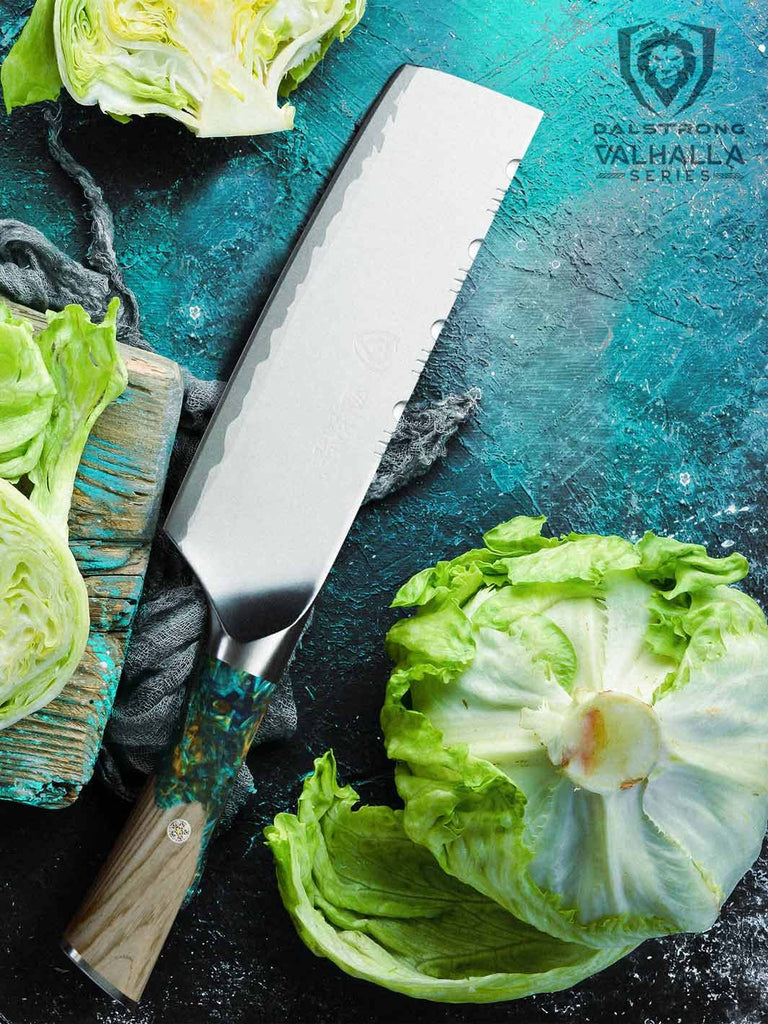 A photo of a lettuce cut in half with the Nakiri Knife 7" | Valhalla Series | Dalstrong