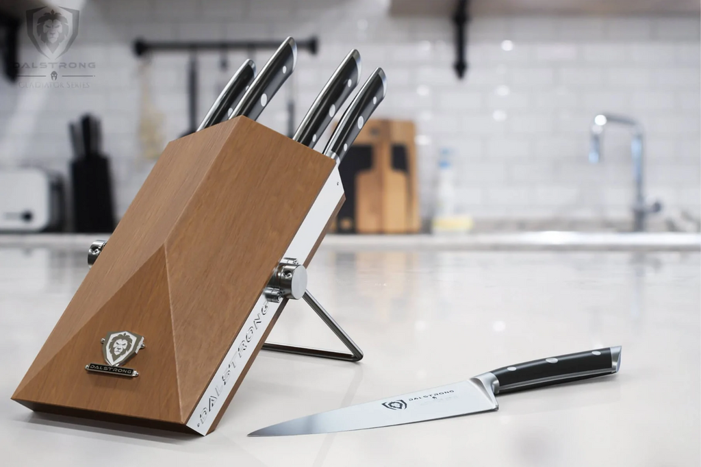 Gladiator Series 5-pc knife block on a beautiful white table with a white sink on the background.