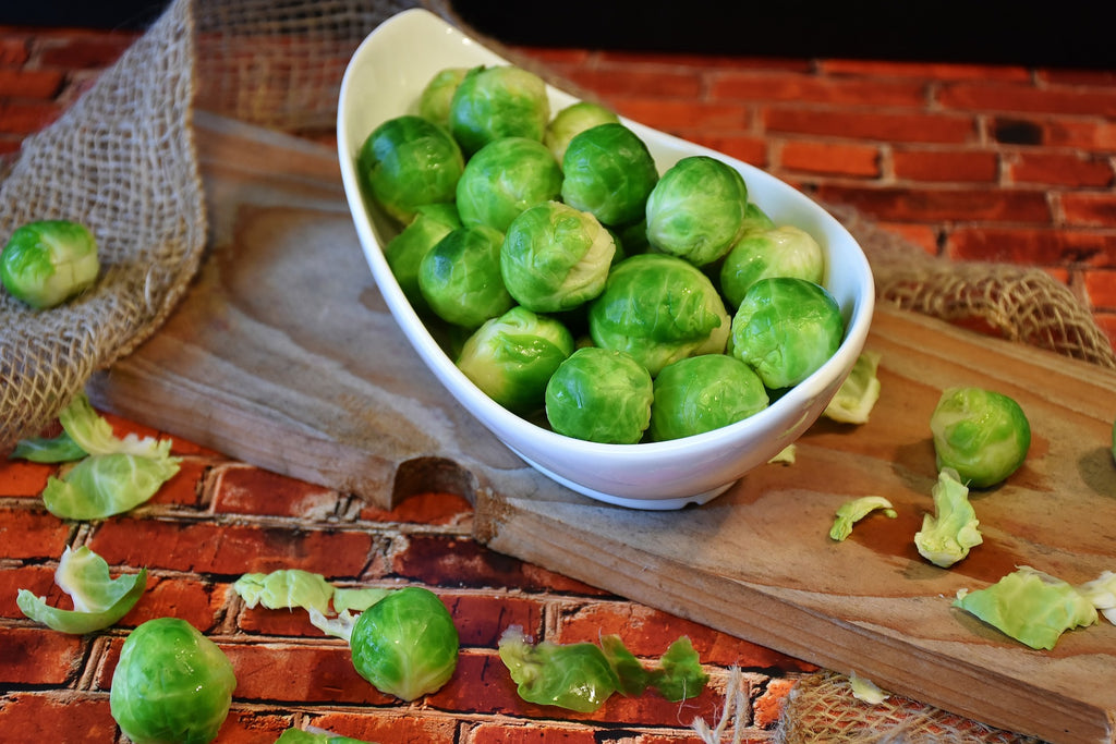 A photo of freshly trimmed brussel sprouts