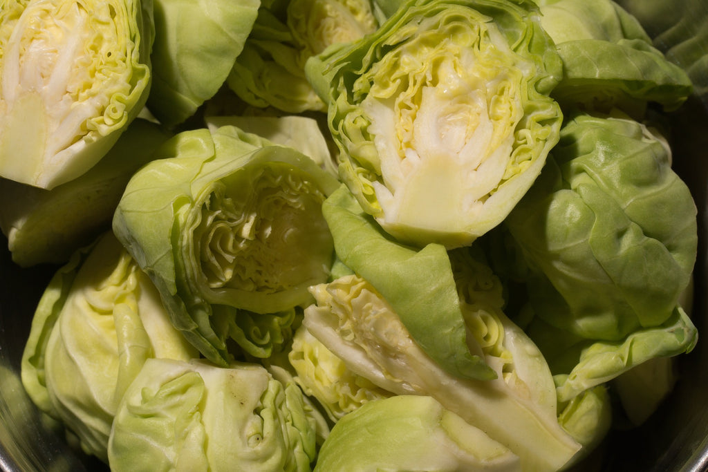A close-up photo of slices of brussel sprouts