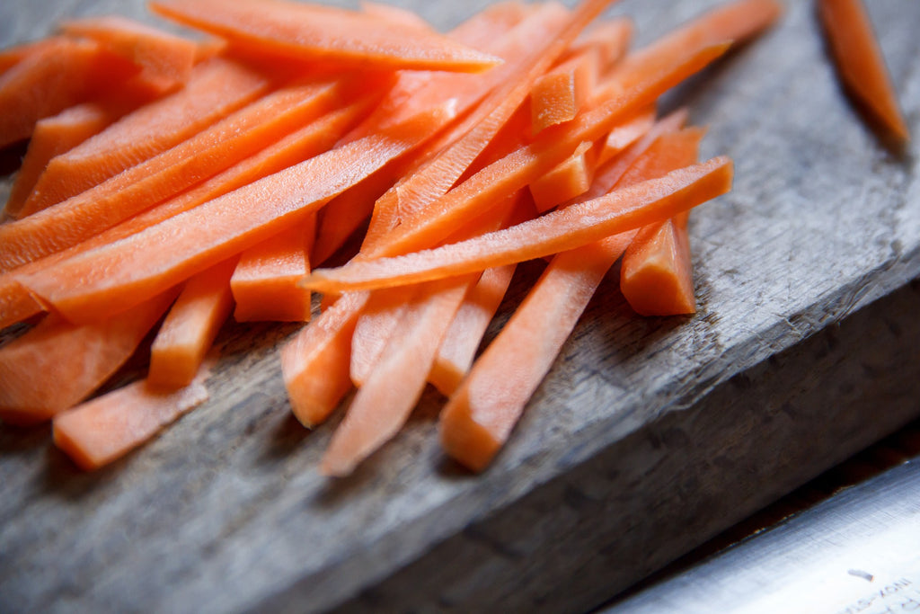 Slices of carrots on a cutting board.