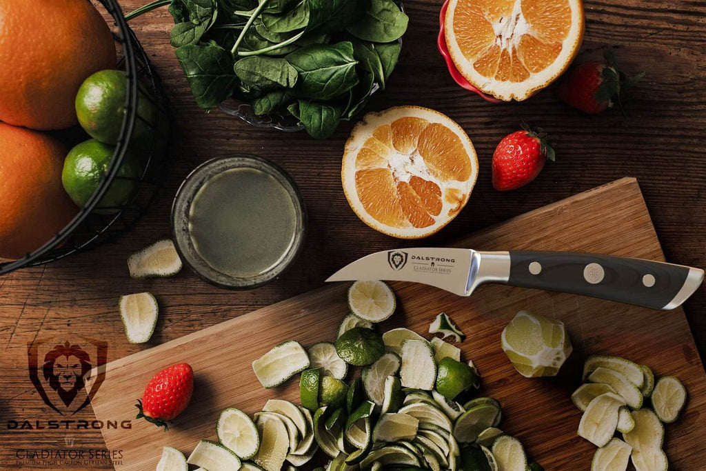 paring knife on cutting board with fruits and vegetables