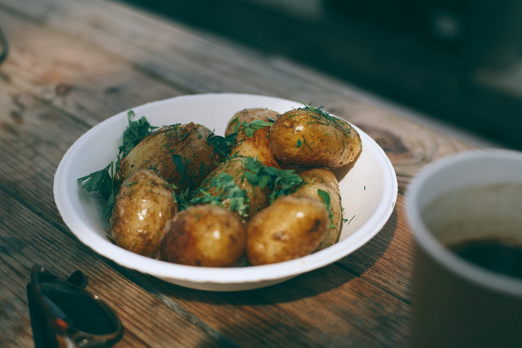 Delicious baked potatoes with greenery